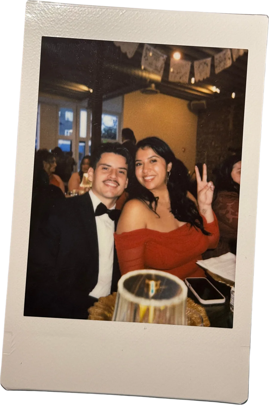 Genesis and Giuliano smiling together at a celebration
